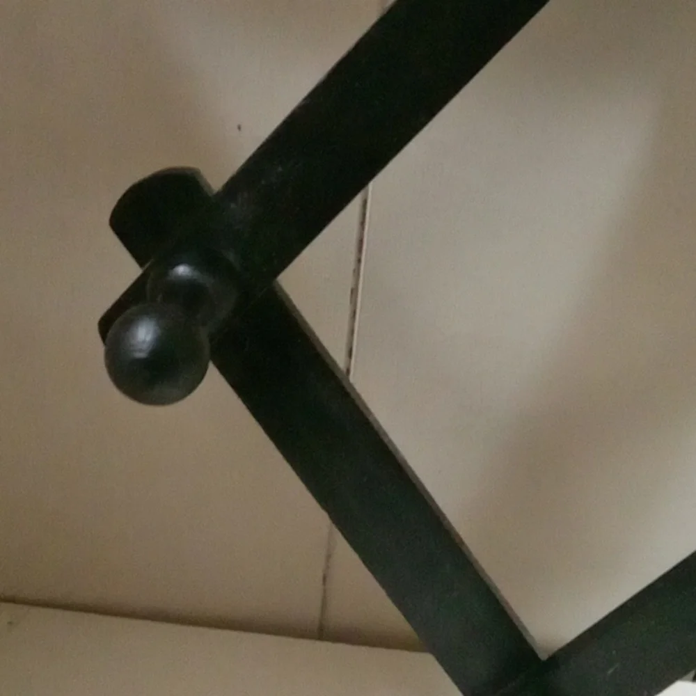 Black Wall-Mounted Coat Rack.